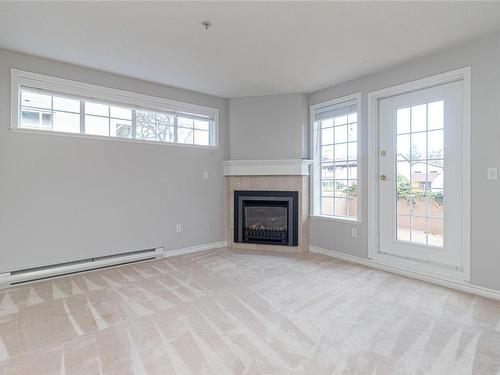 104-1371 Hillside Ave, Victoria, BC - Indoor Photo Showing Living Room With Fireplace