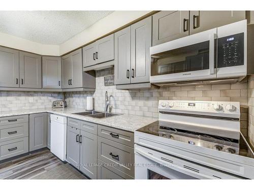 302-6 Shettleston Dr, Cambridge, ON - Indoor Photo Showing Kitchen With Double Sink