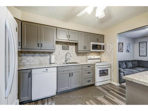 302-6 Shettleston Dr, Cambridge, ON - Indoor Photo Showing Kitchen With Double Sink