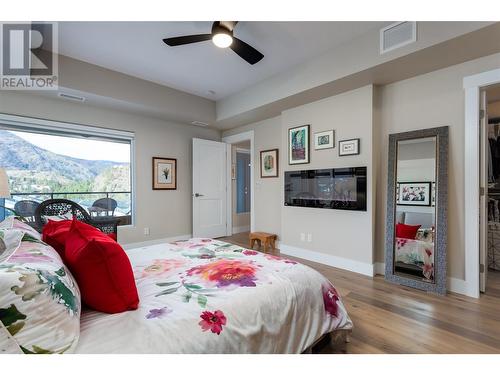 Primary with fireplace - 2161 Upper Sundance Drive Unit# 9, West Kelowna, BC - Indoor Photo Showing Bedroom