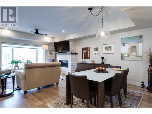 2161 Upper Sundance Drive Unit# 9, West Kelowna, BC - Indoor Photo Showing Dining Room With Fireplace