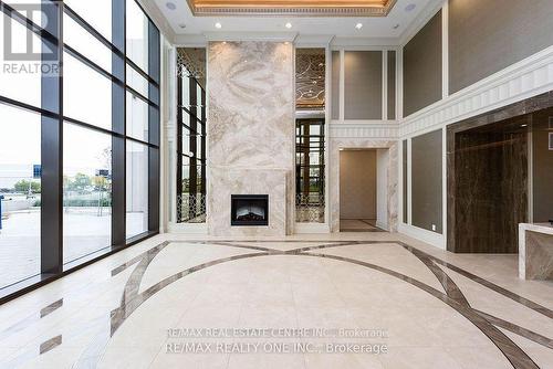 910 - 9075 Jane Street, Vaughan, ON - Indoor Photo Showing Other Room With Fireplace