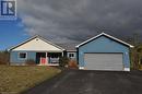 Single story home featuring covered porch, a garage, and a front yard - 1 Williamson Place, South Bruce Peninsula, ON  - Outdoor 