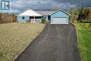 Ranch-style home with a porch, a garage, and a front lawn - 1 Williamson Place, South Bruce Peninsula, ON  - Outdoor 