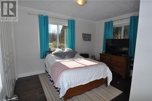 Bedroom with ornamental molding, a closet, and engineered hardwood flooring - 1 Williamson Place, South Bruce Peninsula, ON - Indoor Photo Showing Bedroom