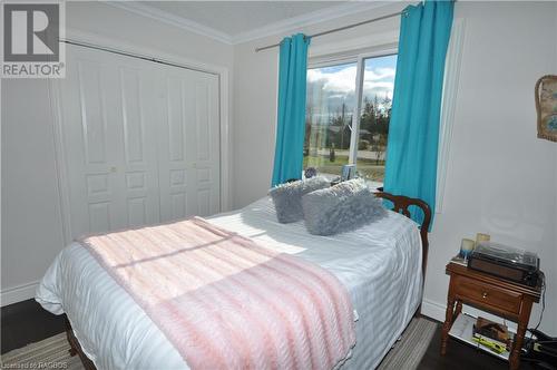 Bedroom Large window, a closet, and crown molding - 1 Williamson Place, South Bruce Peninsula, ON - Indoor Photo Showing Bedroom