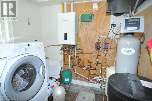 Laundry room featuring washer / clothes dryer and water heater - 1 Williamson Place, South Bruce Peninsula, ON - Indoor Photo Showing Laundry Room