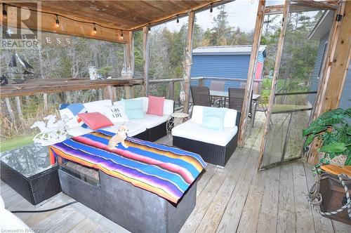 Covered Sunroom with wooden ceiling - 1 Williamson Place, South Bruce Peninsula, ON - Outdoor With Deck Patio Veranda With Exterior