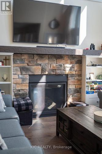 9 - 41 Rosedale Trail, Kawartha Lakes, ON - Indoor Photo Showing Living Room With Fireplace