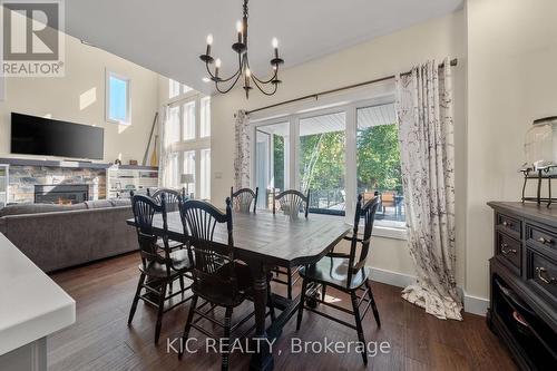 9 - 41 Rosedale Trail, Kawartha Lakes, ON - Indoor Photo Showing Dining Room With Fireplace