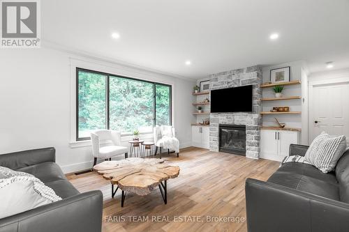 2764 Fairgrounds Road, Severn, ON - Indoor Photo Showing Living Room With Fireplace