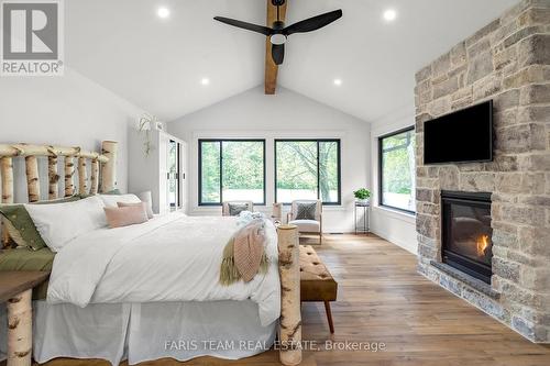 2764 Fairgrounds Road, Severn, ON - Indoor Photo Showing Bedroom With Fireplace