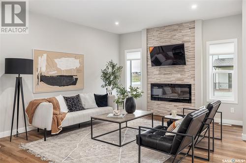 280 Oliver Lane, Martensville, SK - Indoor Photo Showing Living Room With Fireplace