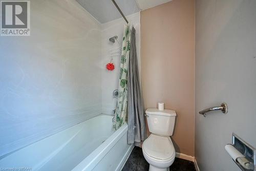 Bathroom with toilet and shower / bathtub combination with curtain - 742 Dundas Street, Woodstock, ON - Indoor Photo Showing Bathroom