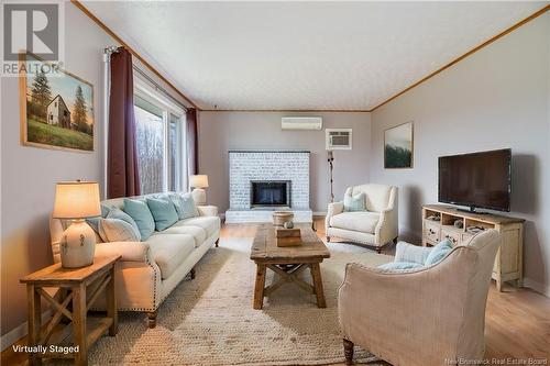 5 Holmes Road, Grand Lake, NB - Indoor Photo Showing Living Room With Fireplace