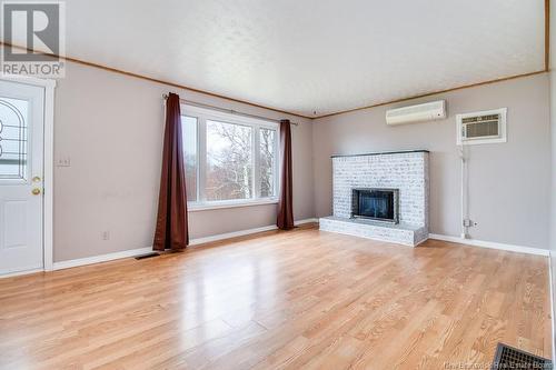 5 Holmes Road, Grand Lake, NB - Indoor Photo Showing Living Room With Fireplace