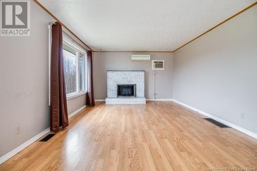 5 Holmes Road, Grand Lake, NB - Indoor Photo Showing Living Room With Fireplace