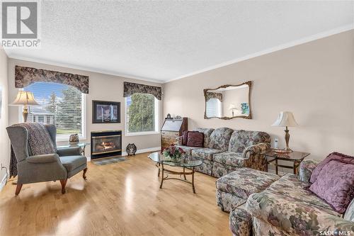 110 Brabant Crescent, Saskatoon, SK - Indoor Photo Showing Living Room With Fireplace