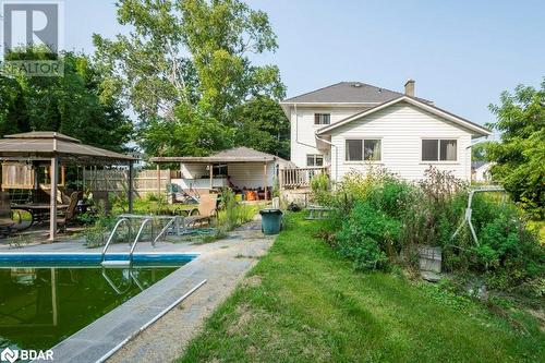 Back of property with a gazebo, a pool side deck, and a lawn - 48 North Trent Street, Frankford, ON - Outdoor With In Ground Pool With Backyard