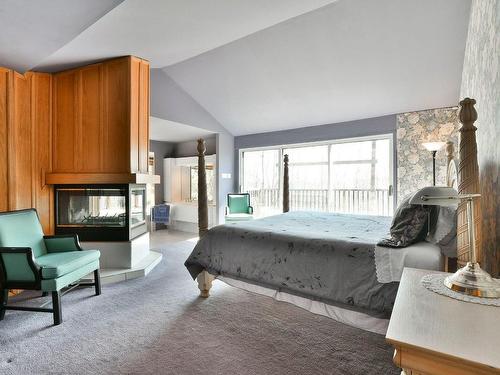 Master bedroom - 14 Ch. Du Mont-Maribou, Saint-Sauveur, QC - Indoor Photo Showing Bedroom With Fireplace