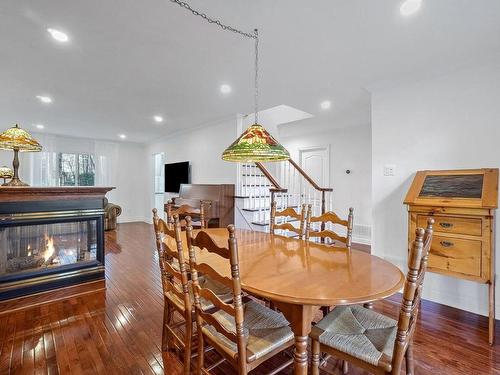 Family room - 1269 Boul. Céloron, Blainville, QC - Indoor Photo Showing Dining Room With Fireplace