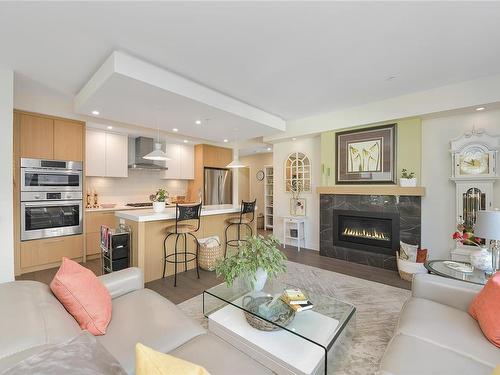 207-9861 Third St, Sidney, BC - Indoor Photo Showing Living Room With Fireplace