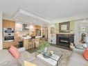 207-9861 Third St, Sidney, BC  - Indoor Photo Showing Living Room With Fireplace 