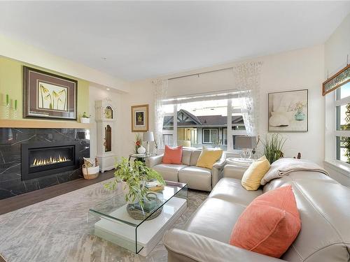 207-9861 Third St, Sidney, BC - Indoor Photo Showing Living Room With Fireplace