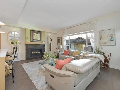 207-9861 Third St, Sidney, BC - Indoor Photo Showing Living Room With Fireplace