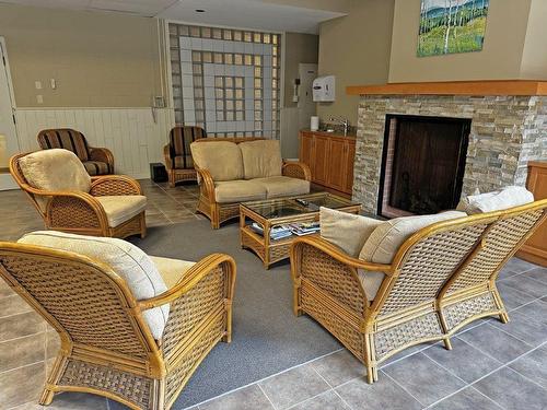 201 590 Beverly Street, Thunder Bay, ON - Indoor Photo Showing Living Room With Fireplace