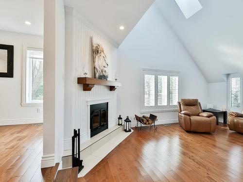 Salon - 139 Boul. Du Val-D'Ajol, Lorraine, QC - Indoor Photo Showing Living Room With Fireplace