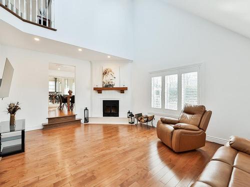 Salon - 139 Boul. Du Val-D'Ajol, Lorraine, QC - Indoor Photo Showing Living Room With Fireplace