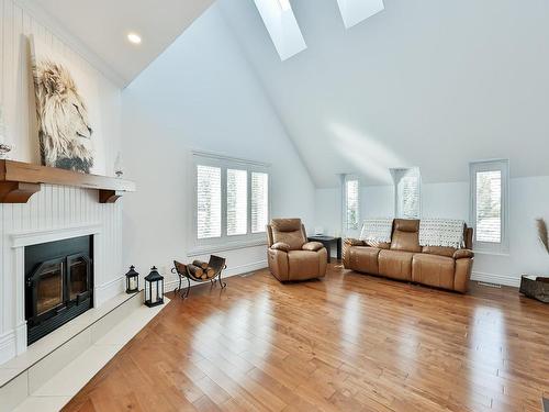 Salon - 139 Boul. Du Val-D'Ajol, Lorraine, QC - Indoor Photo Showing Living Room With Fireplace