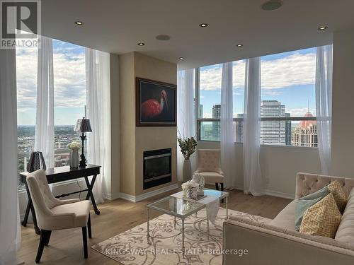 3404 - 220 Burnhamthorpe Road W, Mississauga, ON - Indoor Photo Showing Living Room With Fireplace