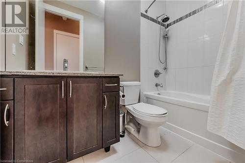 Full bathroom featuring tile patterned flooring, vanity, shower / tub combo, and toilet - 112 Benton Street Unit# 116, Kitchener, ON - Indoor Photo Showing Bathroom