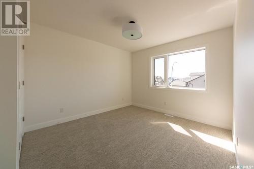 211 Flynn Bend, Saskatoon, SK - Indoor Photo Showing Other Room