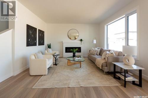 211 Flynn Bend, Saskatoon, SK - Indoor Photo Showing Living Room With Fireplace