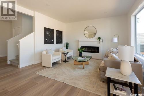 211 Flynn Bend, Saskatoon, SK - Indoor Photo Showing Living Room With Fireplace