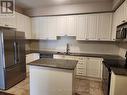 328 - 8111 Forest Glen Drive, Niagara Falls (208 - Mt. Carmel), ON  - Indoor Photo Showing Kitchen With Double Sink 