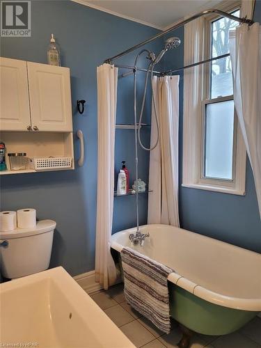 Bathroom featuring tile patterned flooring and shower / bath combo - 1061 Margaret Street, London, ON 