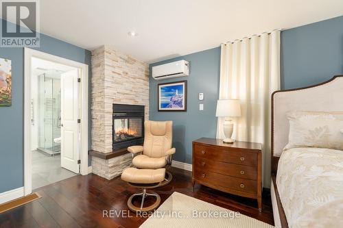 22 Red Haven Drive, Niagara-On-The-Lake, ON - Indoor Photo Showing Bedroom With Fireplace