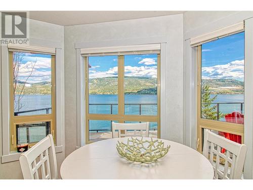 7016 Barcelona Drive Unit# 6, Kelowna, BC - Indoor Photo Showing Dining Room With Body Of Water