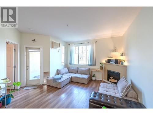 921 Spillway Road Unit# 103A, Oliver, BC - Indoor Photo Showing Living Room With Fireplace