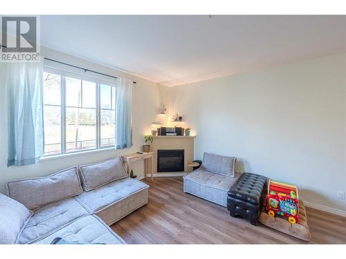 921 Spillway Road Unit# 103A, Oliver, BC - Indoor Photo Showing Living Room With Fireplace