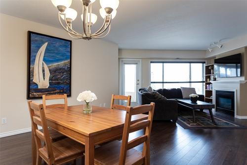 312-265 Snowsell Street, Kelowna, BC - Indoor Photo Showing Dining Room With Fireplace