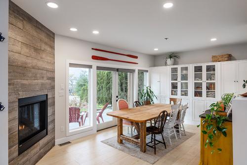 11527 Lang Court, Lake Country, BC - Indoor Photo Showing Dining Room With Fireplace