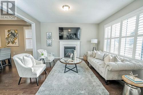 96 Bridlewood Boulevard, Whitby, ON - Indoor Photo Showing Living Room With Fireplace