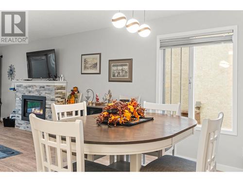 3900 27 Avenue Unit# 24, Vernon, BC - Indoor Photo Showing Dining Room With Fireplace