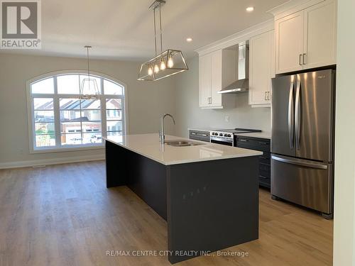 Kitchen + DR - 2305 Callingham Drive, London, ON - Indoor Photo Showing Kitchen With Stainless Steel Kitchen With Double Sink With Upgraded Kitchen