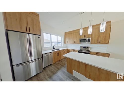 #Main 5715 Hawthorn Cm Sw, Edmonton, AB - Indoor Photo Showing Kitchen With Stainless Steel Kitchen With Double Sink